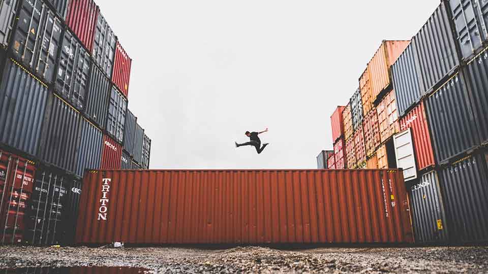 Person-jumps-over-container