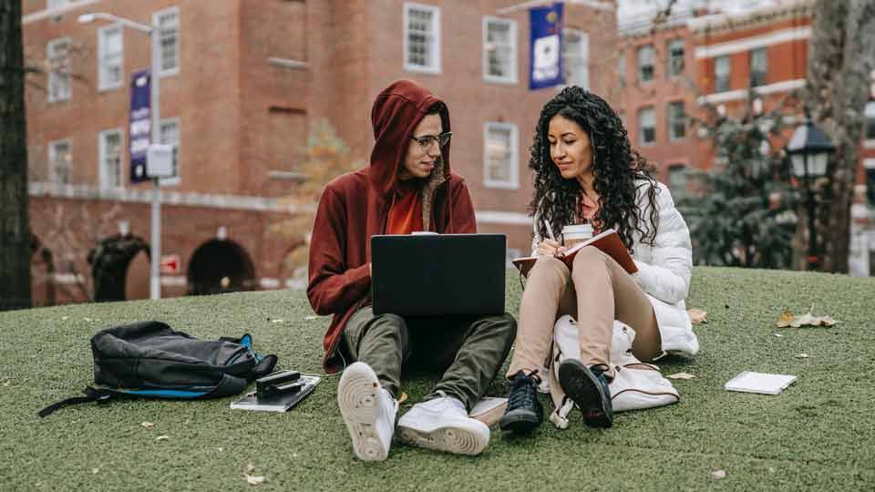 Students learning in a park